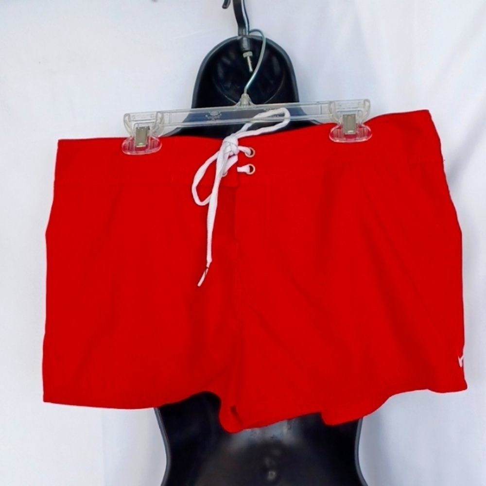 Red Nike swim shorts, Jr size medium